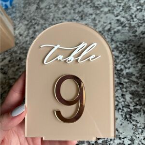 Tan, Gold, and White Table Number Signs